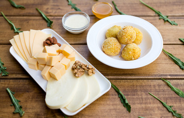 cheese balls with sauce on a plate