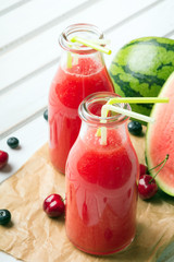 Fresh watermelon juice on a wooden background