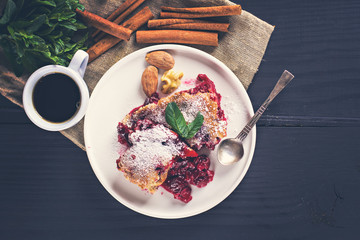 Cherry pie and a cup of coffee. Rustic style. Berry pie. Homemade cherry pie with flaky crust, cup of coffee, bowl with cherries