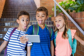 School kids taking selfie from mobile phone