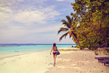 a beautiful woman on a tropical beach