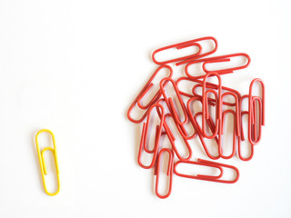 Paper clips arrange to symbolize on white background to be diffe