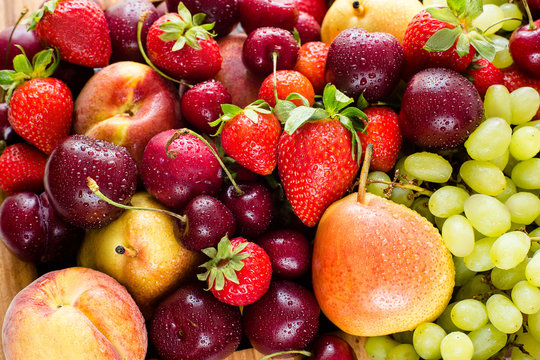 Fresh mixed fruits, berries background.Healthy eating.Love fruit, diet.