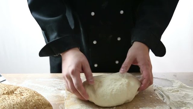 chef cut the dough into three parts