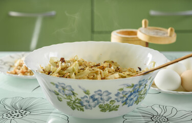 white bowl with roasted cabbage for pies