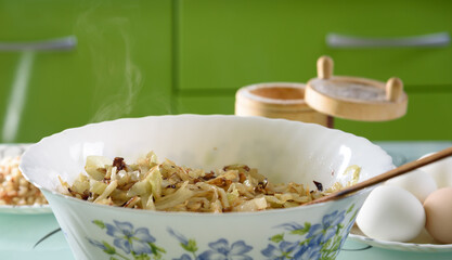 white bowl with roasted cabbage for pies