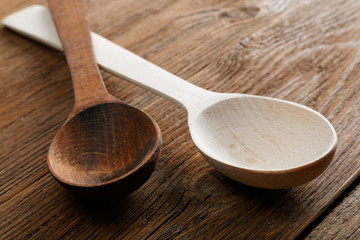 wooden spoons on an old kitchen table