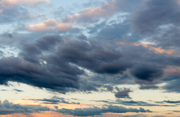Naklejka na ściany i meble Beautiful cloudy sky with sun rays. Cloudy abstract background. Sunset light.