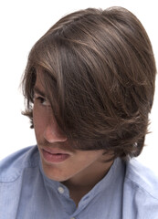 portrait of teen boy with long surfer haircut