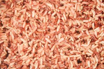 Close up brown rice in rice cooker, healthy eating background concept. top view