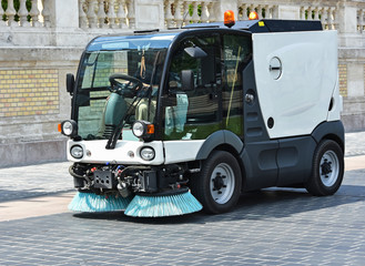 Street cleaner vehicle at work
