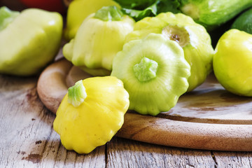 Squash or zucchini on old wooden table, rustic style, selective
