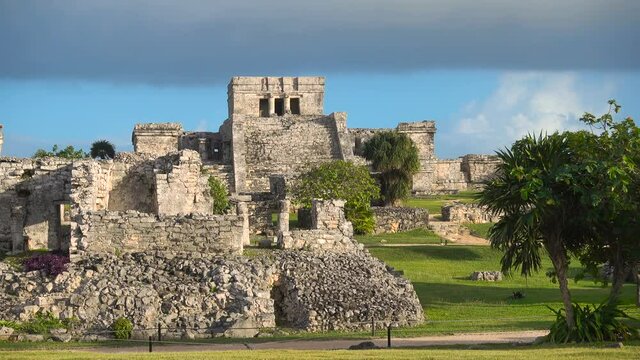 establishing shot of tulum mayan site temple at sunset no people