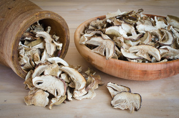 Dried porcini mushrooms on a wooden table. Rustic style. Harvest.