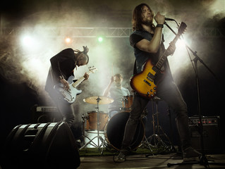 Fototapeta na wymiar Rock band playing on stage.