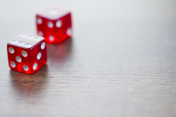 Two Red Dices Isolated on Desktop with Right Space