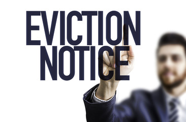 Business man pointing the text: Eviction Notice