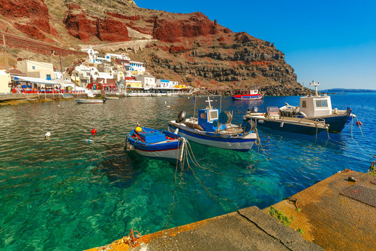 Fishing Boats At Old Port Ammoudi Of Oia Village At Santorini Island In Aegean Sea, Greece