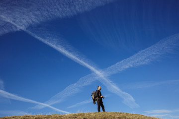 Hiker photographer on a mountain top