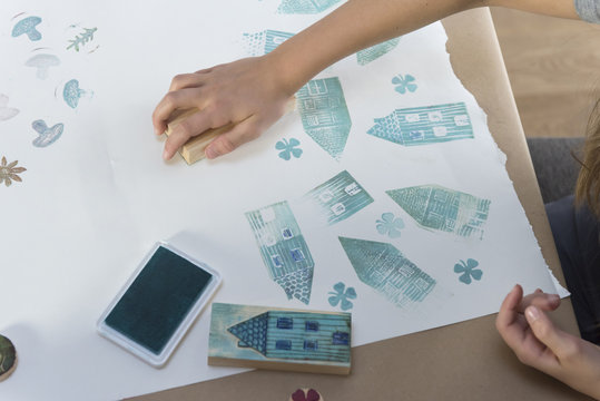 Girl stamping on paper