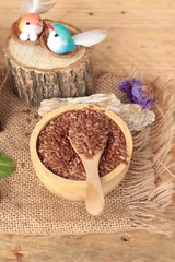 Fototapeta na wymiar Flax seeds for health on wood background.