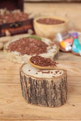Flax seeds for health on wood background.