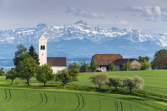 Germany, Lake Constance district, St. Michael's Church near Ueberlingen, Swiss Alps with Saentis in the background