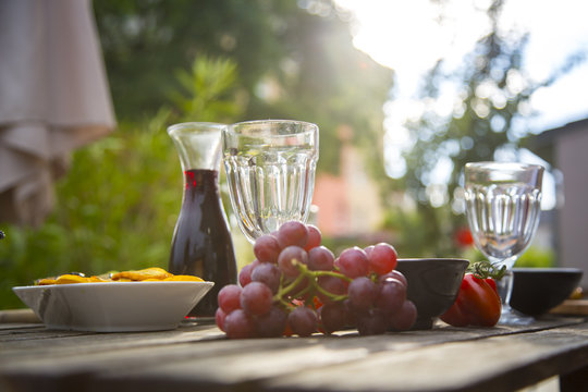 Mediterranean antipasti and wine on garden table