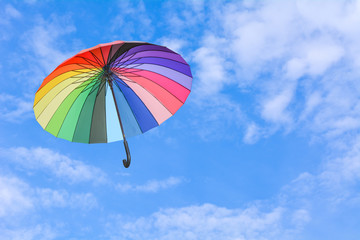 Colourful umbrellas floating in the sky