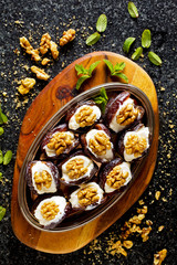 Dates Fruit  Dessert  with ricotta and Walnuts on marble