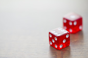 Two Red Dices Isolated on Desktop with Upper Left Space