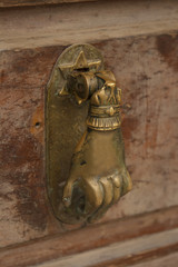 Door handle with human hand and David star 