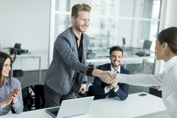 Fototapeta na wymiar Business people shaking hands in the office