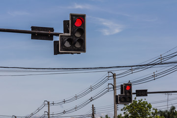 The traffic light with a beautiful blue sky in background