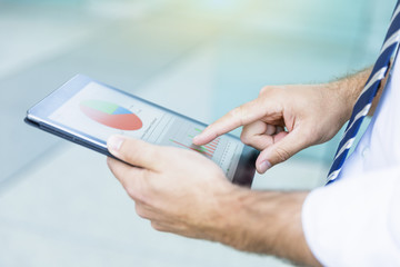 close up of a Businessman hands using tablet