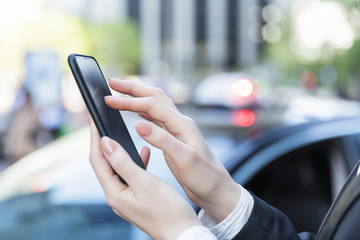 close up of a Businesswoman hands using a smartphone
