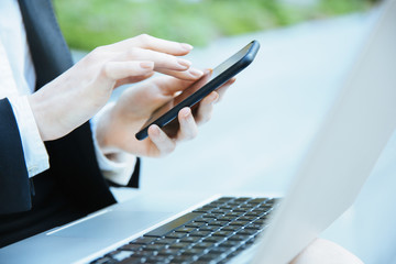 close up of a Businesswoman hands using a smartphone