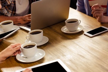 Focus on laptop with coffee