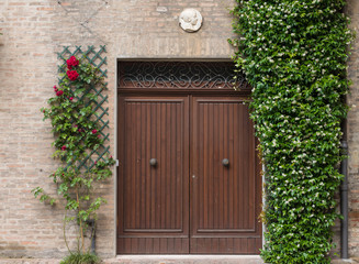Entrance door of an an old house in Italy