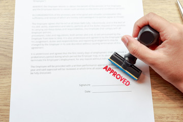 Approved the contract documents with rubber stamp