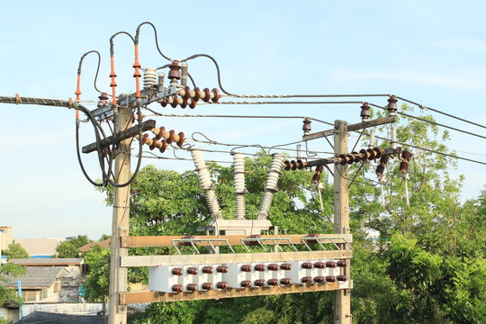 Transformer on concrete electric pole or electricity post, wire and porcelain insulators