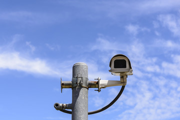 Close circuit camera,The close circuit camera on the pole with the blue sky background.The security system from the close-circuit camera with the sky.