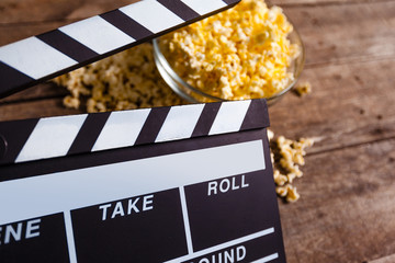 Movie clapper board and pop corn