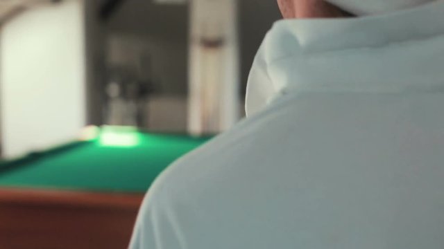 man playing pool at the cottage
