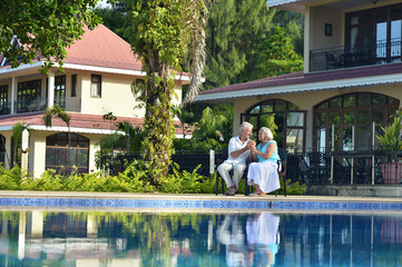 Senior couple near pool