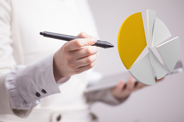 Woman shows a pie chart, circle diagram. Business analytics concept.