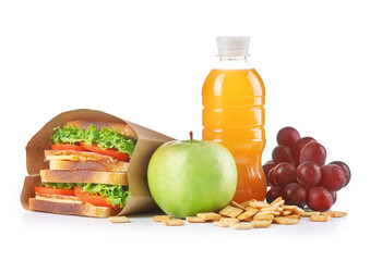 Healthy school lunch with sandwich, fruits and juice isolated on white