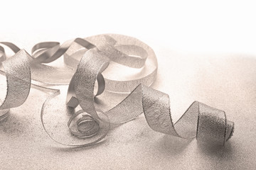 Grey ribbon  on light textured background