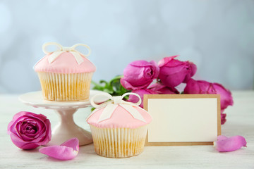 Mother Day concept. Roses with cupcake on bokeh background