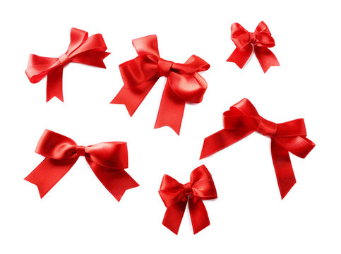 Red ribbon bows on a white background